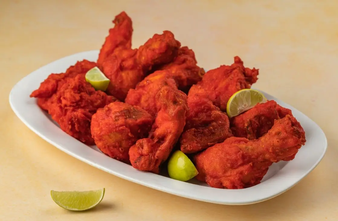 Chicken lollipops garnished with lime