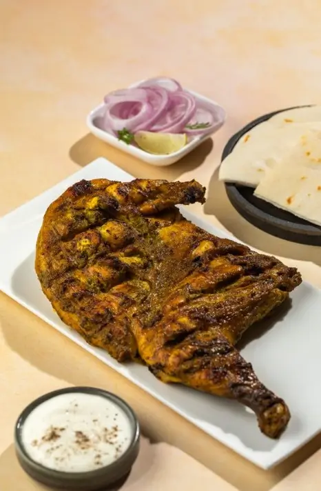 Grilled marinated fish served with roti